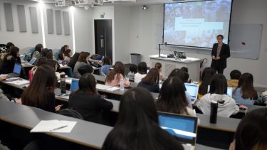 A class of masters students in a lecture.